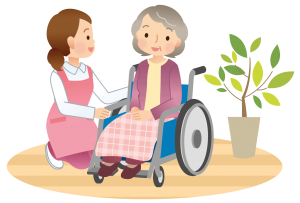 Pflegerin kümmert sich um Bewohnerin im Rollstuhl